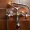 Bathroom mixing tap with shower on brown tiles